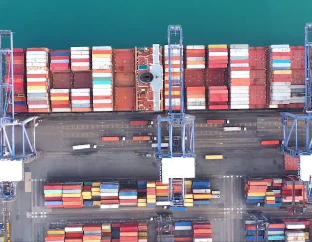 Bird view of containers ship at the port unloading